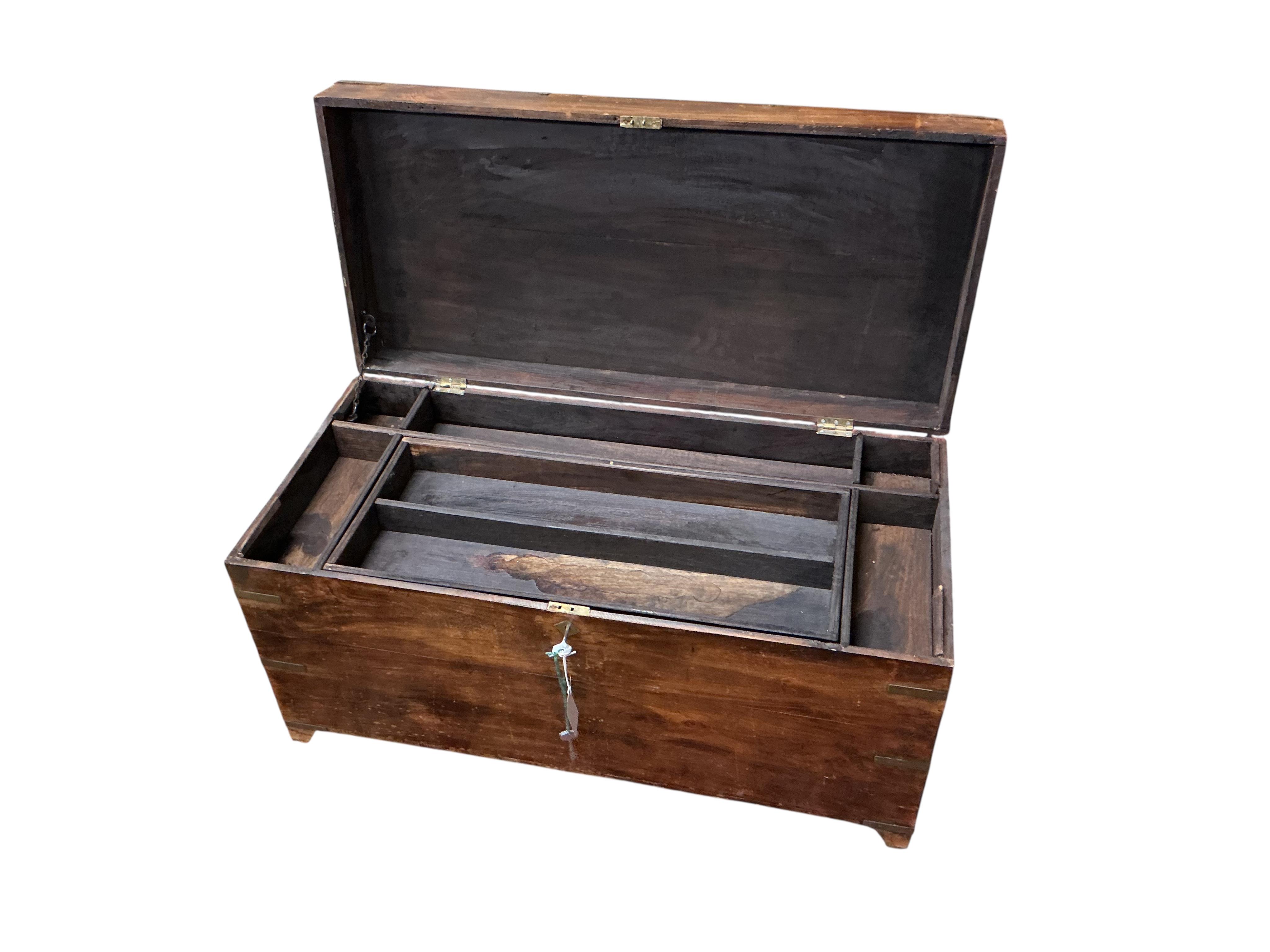 A late 19th century Anglo Indian brass bound hardwood trunk, width 86cm, depth 40cm, height 46cm